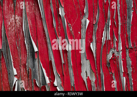 USA, Alaska. Peeling red paint on wood. Stock Photo