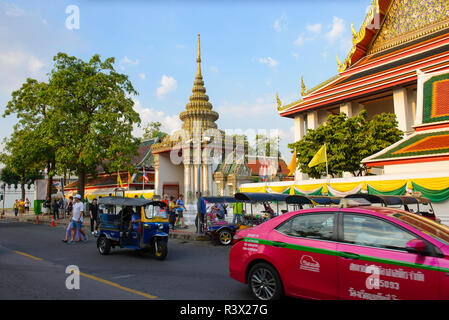 Tuk tuk and taxi on the background of Wat Pho Stock Photo