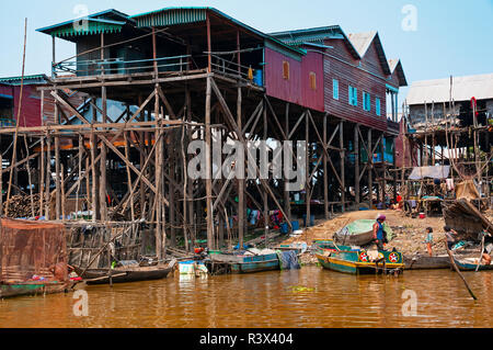 Stilt or stilted fishing village houses, in the dry season, situated on the banks of an estuary connecting it to Tonle Sap Lake,Cambodia Stock Photo
