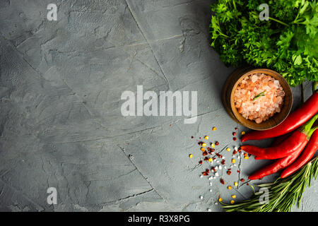 Organic spices and herbs  on rustic background with copy space Stock Photo