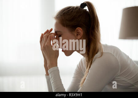 Upset female feel broken hearing bad news Stock Photo