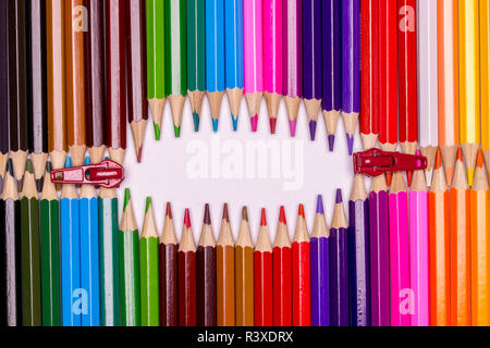 Creative still life concept made of colorful pencils to look like a zip Stock Photo