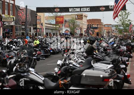 Motorcycles and crowds of people on Main Street in Sturgis during the worlds largest annual motorcycle rally. Stock Photo