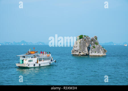 Boat and island in Halong Bay Stock Photo