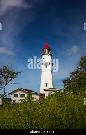 USA, Hawaii, Oahu, Morning light on Diamond Head Lighthouse with Puffy Clouds Stock Photo