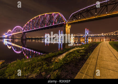 Lights on Big Four Bridge, Abraham Lincoln Bridge, and downtown Louisville, Kentucky at night, viewed from Jeffersonville, Indiana Stock Photo