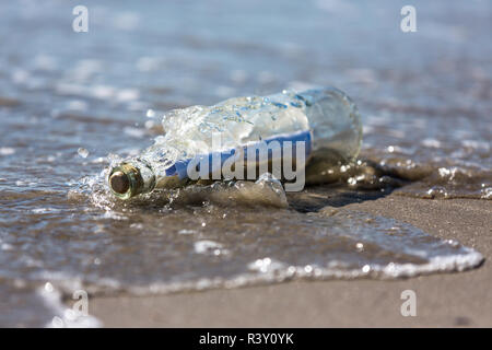 message in a bottle washed ashore Stock Photo