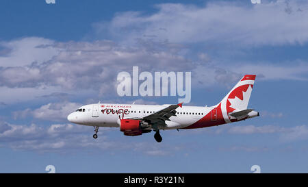 Air Canada 'Rouge' Airbus A319 Flying in Beautiful Sky Stock Photo