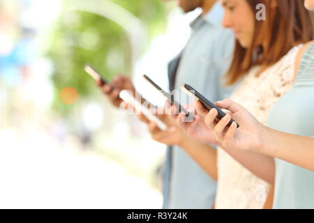 Two boys plays online games in quarantine. Young boys smile and use phone.  One look how play another Stock Photo - Alamy