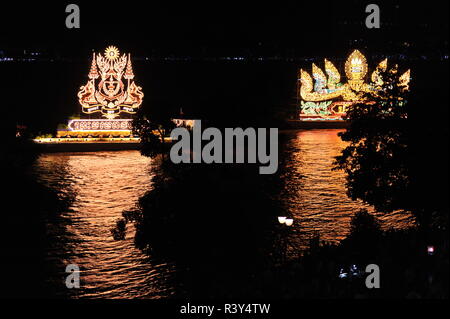 Phnom Penh, Cambodia. 23rd November, 2018. Phnom Penh celebrates Bon Om Touk, The Cambodian Water Festival, Illuminated floats, one w/ nagas, cast their reflection on The Tonle Sap River. © Kraig Lieb / Alamy Live News Stock Photo