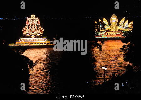 Phnom Penh, Cambodia. 23rd November, 2018. Phnom Penh celebrates Bon Om Touk, The Cambodian Water Festival, Illuminated floats, one w/ nagas, cast their reflection on The Tonle Sap River. © Kraig Lieb / Alamy Live News Stock Photo