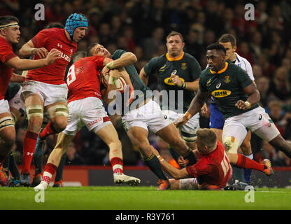 Principality Stadium, Cardiff, UK. 24th Nov, 2018. Rugby Union, Autumn International series, Wales versus South Africa; Handre Pollard of South Africa is tackled by Gareth Davies and Gareth Anscombe of Wales Credit: Action Plus Sports/Alamy Live News Stock Photo