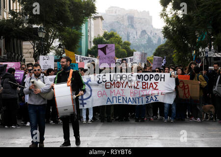 Athens, Greece. 24th Nov, 2018. People take part in a march mainly focusing on violence against women on the eve of the International Day for the Elimination of Violence against Women in Athens, Greece, on Nov. 24, 2018. On the eve of the International Day for the Elimination of Violence against Women which falls on Nov. 25 each year, Greek authorities, experts and victims of abuse called on women suffering in silence across the country to 'speak up.' Credit: Marios Lolos/Xinhua/Alamy Live News Stock Photo