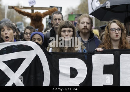 London, Greater London, UK. 24th Nov, 2018. Environmental activists seen holding a banner during the protest. Thousands of demonstrators from the new Extinction Rebellion climate change movement gathered at Parliament Square for a memorial and funeral march through London. Demonstrators paid homage to the lives lost due to climate change, and marched carrying a coffin from Parliament Square to Buckingham Palace. Credit: Andres Pantoja/SOPA Images/ZUMA Wire/Alamy Live News Stock Photo