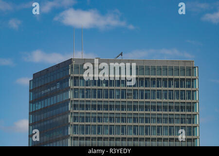 Modern building with the logo of Deutsche Bank in the top floors. Stock Photo