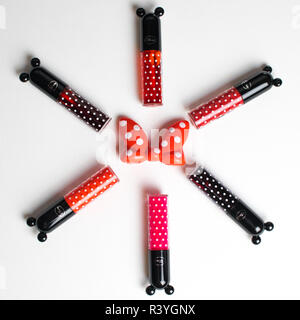 liptints with Minnie disney composition flatlay on white background Stock Photo