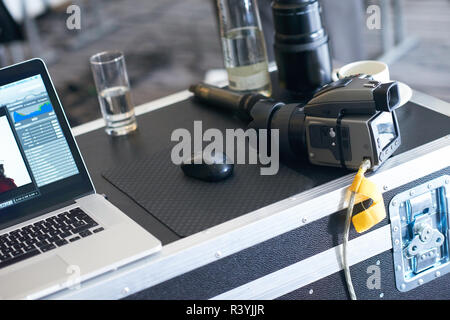 medium format photo camera connected to laptop computer Stock Photo