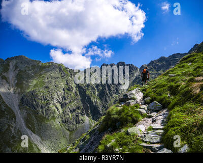 Tourist on footpath in tatra mountains in tatra national park in Poland Stock Photo