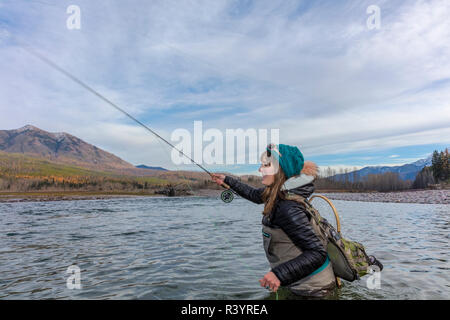 USA, Montana, woman fly fishing for … – License image – 70434822 ❘  lookphotos