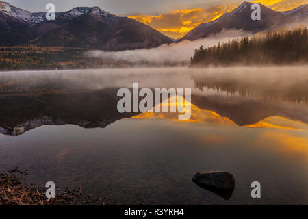 Sunrise fog on Holland Lake in the Flathead National Forest, Montana, USA Stock Photo