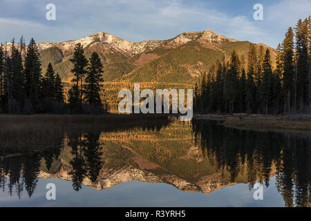 Swan Mountains reflecting into Holland Lake in the Flathead National Forest, Montana, USA Stock Photo