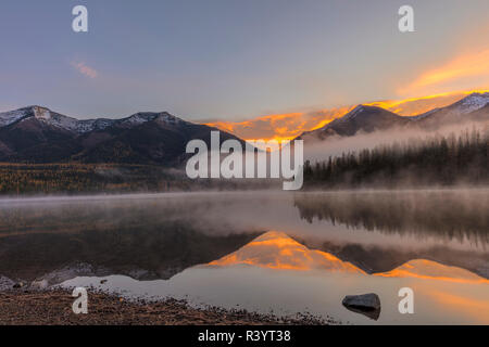 Sunrise fog on Holland Lake in the Flathead National Forest, Montana, USA Stock Photo