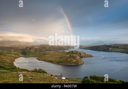 Light mood with rainbow over the sea inlet Loch Inchard, Kinlochbervie, Sutherland, North-West Highlands, Scotland Stock Photo