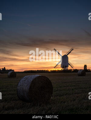 Chillenden Windmill in the Kent countryside, silhouetted at sunset. Stock Photo