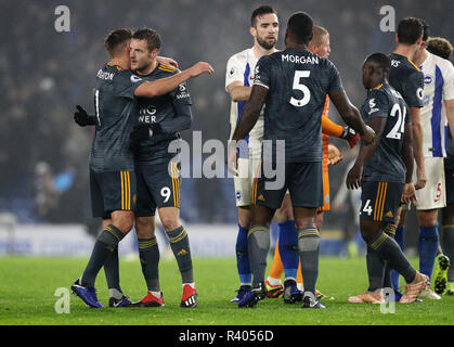 Leicester City's Jamie Vardy (2nd left) and team-mate Marc Albrighton celebrate the draw after the Premier League match at The Amex Stadium, Brighton. Stock Photo