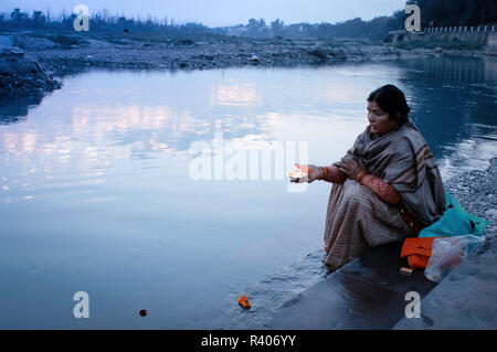 Morning prayer Holy Ganges river. Rishikesh, India Stock Photo