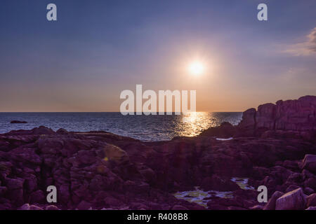 sunset at the granite rocks of Saint-Guenole Brittany, France Stock Photo