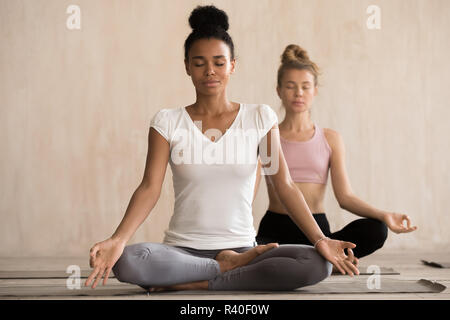 African Ethnicity Woman and Associates Lying on Mats Practicing Balasana  Stock Photo - Image of child, energy: 174216656