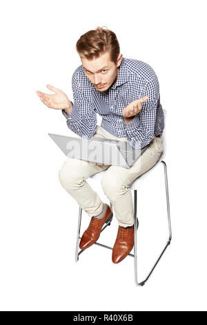 Young man gesturing by hands Stock Photo