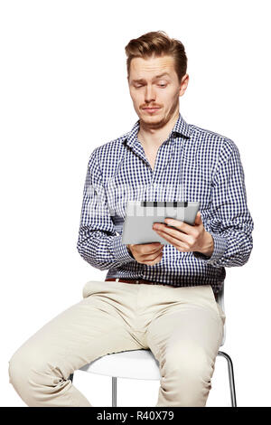 Man looks on tablet Stock Photo