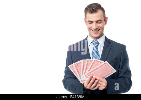 Businessman gambling his luck Stock Photo