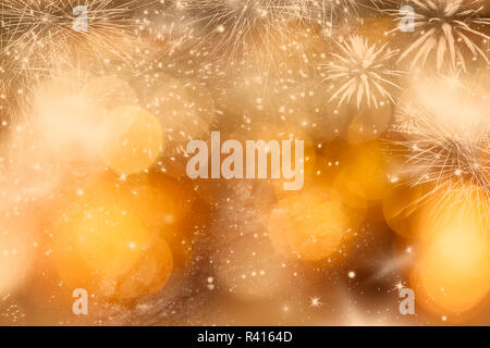 Abstract holiday background with fireworks and sparkling lights Stock Photo