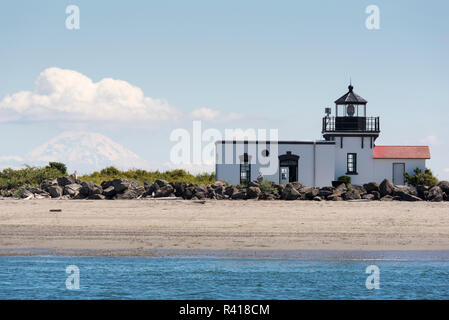 USA, Washington State, Kitsap County. Mt. Rainier behind Point No Point Lighthouse Hansville. Stock Photo