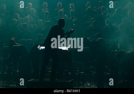 KYIV, UKRAINE - NOVEMBER 22, 2018: Conductor of Symphony Orchestra Andrey Chernyi performs on stage during "The Game of Thrones" concert at National P Stock Photo