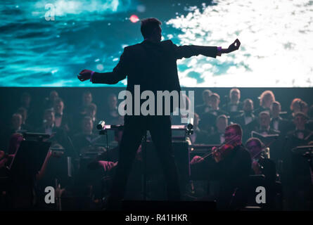 KYIV, UKRAINE - NOVEMBER 22, 2018: Conductor of Symphony Orchestra Andrey Chernyi performs on stage during "The Game of Thrones" concert at National P Stock Photo