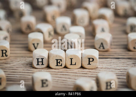dice forming the word HELP Stock Photo