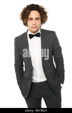 Young serious guy posing in  wedding suit Stock Photo