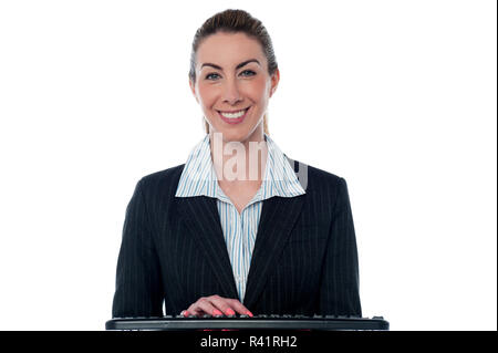Woman typing on keyboard Stock Photo