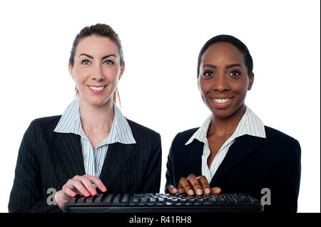 Business women typing on keyboard Stock Photo