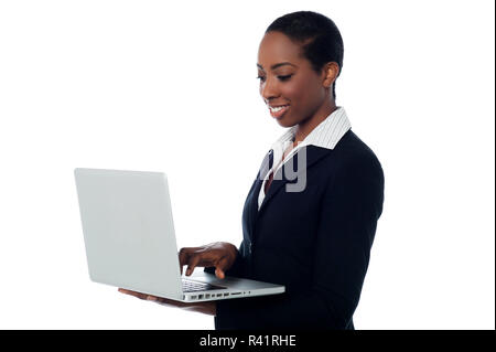 Corporate woman working on laptop Stock Photo