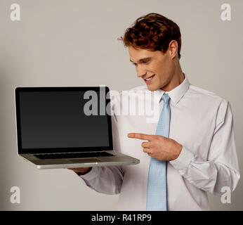 Smart executive showing new  laptop Stock Photo