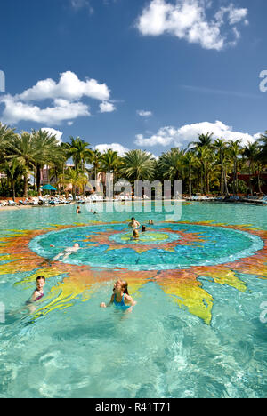 A large sun is in the center of this pool at the Atlantis Resort, Paradise Island, Bahamas Stock Photo