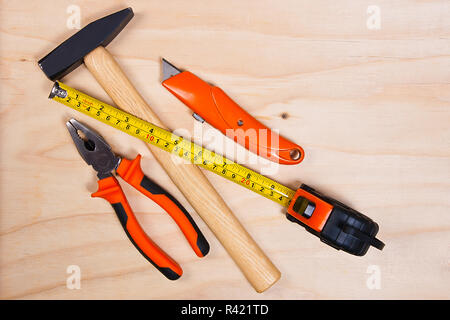 Close up of assorted work tools on wood Stock Photo