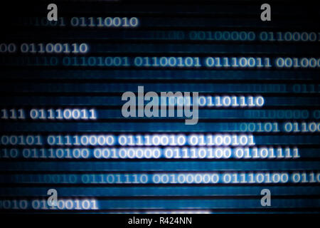 binary code data bit screen display on laptop computer screen. matrix of data flow. Rise of big data AI age. artificial intelligence data transfer. te Stock Photo