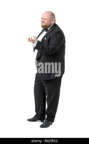 Jolly Fat Man in Tuxedo and Bow tie Shows Emotions Stock Photo