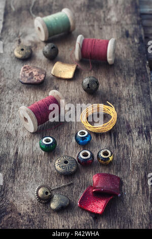 Handmade button bracelet. Set of bright colored buttons, pliers